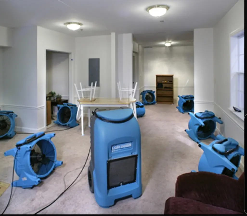 Air movers and dehumidifier setup for Water Damage Restoration in East Allen
